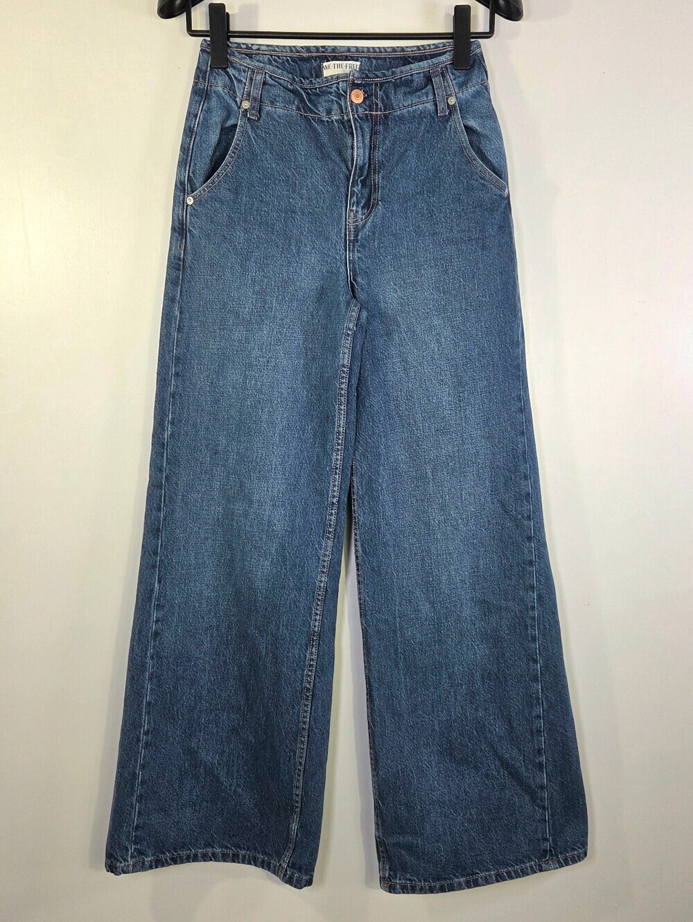 FREE PEOPLE WE THE FREE THE HARLOW MID RISE WIDE LEG JEANS.